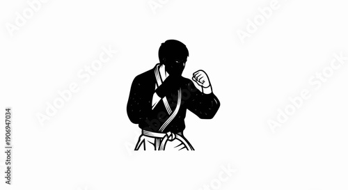 Martial artist in black gi with white belt in fighting stance