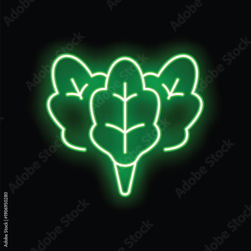 Green neon sign representing three spinach leaves, glowing on a black background