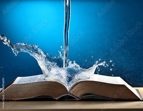 water gushing from an open bible blue background