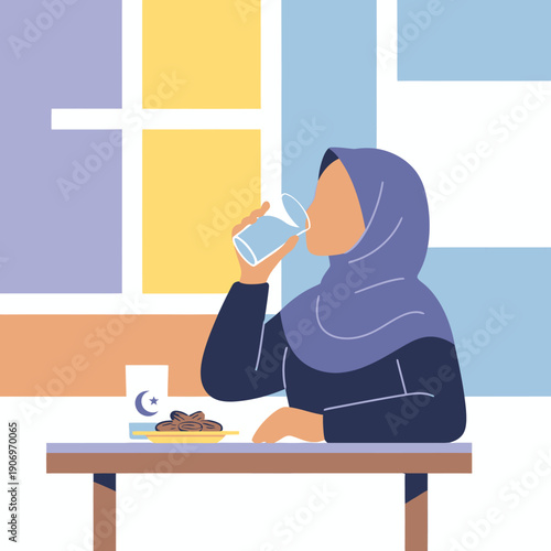 woman wearing hijab drinking water.