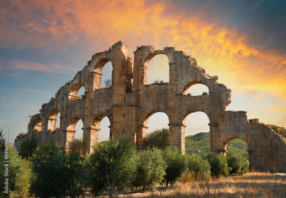 Fototapeta premium The aqueducts of Aspendos Ancient City at sunrise. Antalya city. Türkiye