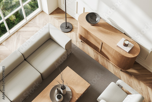 Quadro em tela Stylish modern living room with beige sofa, wooden coffee table, and sideboard in minimalist interior design, top view on wooden floor
