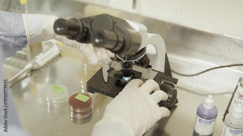 Scientist using microscope in laboratory 4k