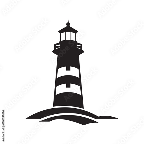 Classic black and white silhouette of a lighthouse on a rocky outcrop