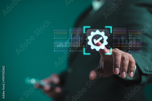 The businessman displays an interface showing digital quality assurance and certification symbols, representing high standards, ISO compliance, and professional business excellence.