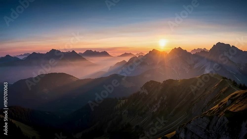 Sunrise over misty mountains, illuminating the peaks with golden light, creating a serene and majestic landscape