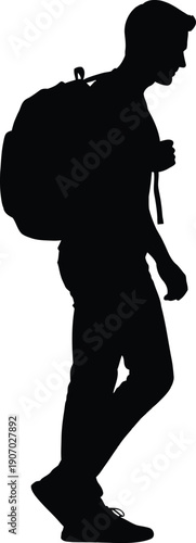 Man with backpack walking alone outside in profile view