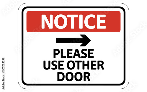 Notice sign indicating alternative door to use with directional arrow
