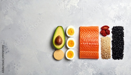 Healthy Food Ingredients Arranged Neatly on Textured Grey Surface.