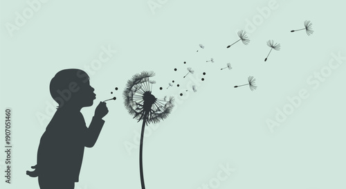 Child blowing dandelion seeds silhouette.