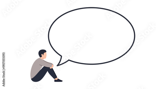 Man sitting on the floor with a blank speech bubble beside him thinking deeply and contemplatively alone