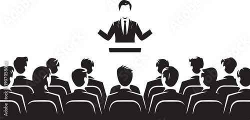 Person speaking to audience in lecture hall setting with attentive listeners