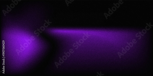 Purple light shining on a black grainy background