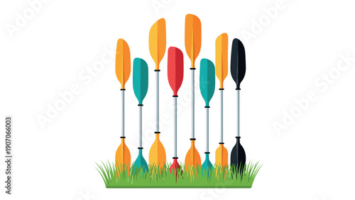 Colorful kayak paddles arranged upright in vibrant grass setting on white background