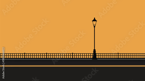 Ornate street lamp and railing on a road lamp post