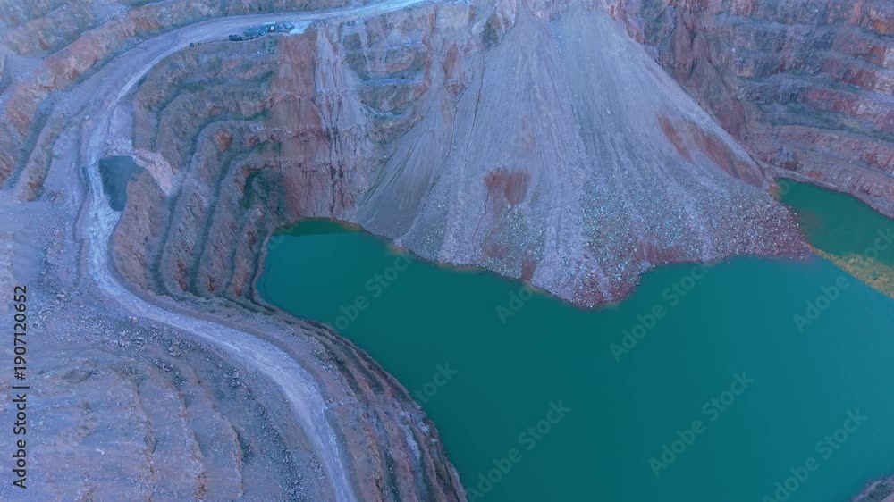 Video „Towering quarry slopes descending into deep basin filling with ...