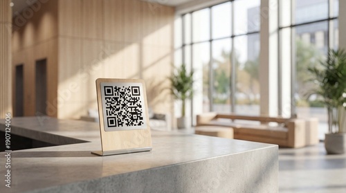 QR code displayed on a wooden stand on a reception desk in a modern office lobby