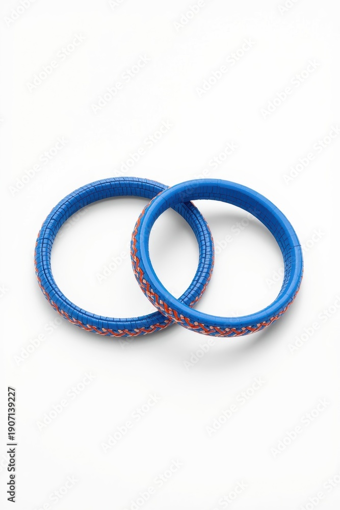 Fototapeta premium Two vibrant blue rings with red and white dotted patterns displayed together