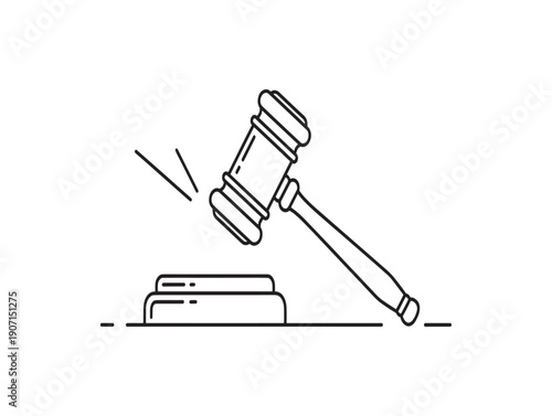 A gavel striking a sound block in a courtroom setting