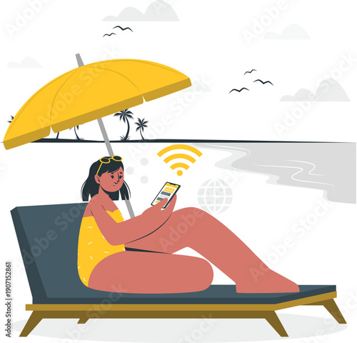 Woman relaxing on a sun lounger under a parasol using a mobile phone by the beach