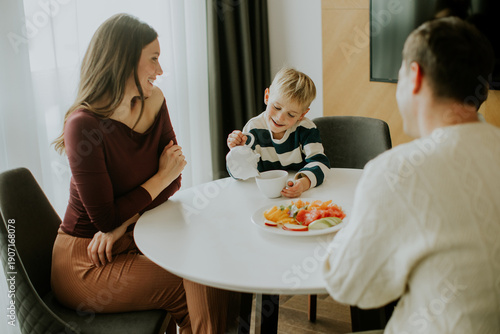 Family enjoys breakfast tog...
