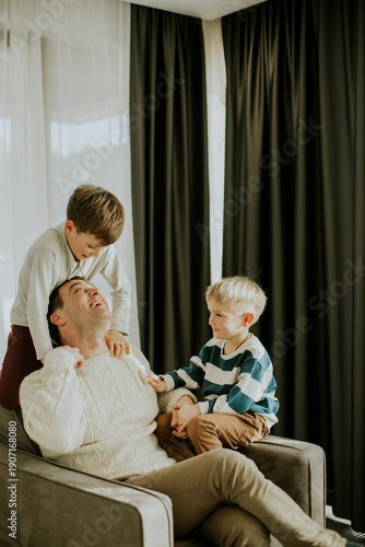 Father plays with children ...