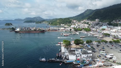 Angra Dos Reis, Brazil, January 13, 2025: Aerial footage of the pulsating harbour area in Angra dos Reis, with the surrounding mountains with the Atlantic Forest along the coast and behind the city