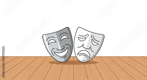 A smiling theatrical mask and a frowning dramatic mask are arranged on a wooden floor against a simple white background.