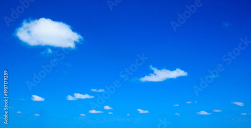 blue sky background with tiny clouds