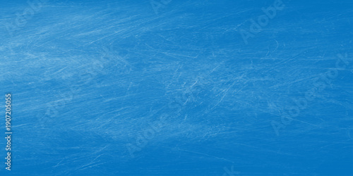 A clear turquoise swimming pool surface creates a cool liquid texture with ripples and waves reflecting the summer sun across the transparent blue aqua water