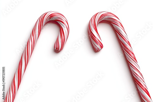 Two curved, red and white striped peppermint candies, slightly angled, against a white backdrop