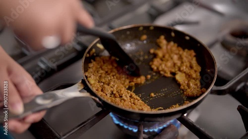 Close-Up of Browning Seasoned Ground Beef or Pork in a Nonstick Frying Pan