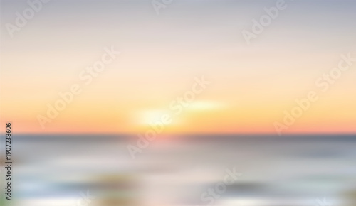 Soft focus orange and blue sunset over the ocean creating a tranquil gradient background for peaceful designs
