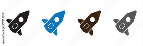 Set of colorful paper airplanes flying in formation against white background