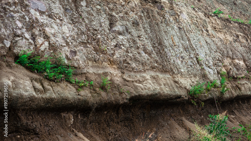Quadro em tela Geologic stratification of soil and stone layers with natural erosion pattern