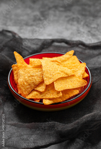 Crispy corn tortilla nachos chips in a bowl