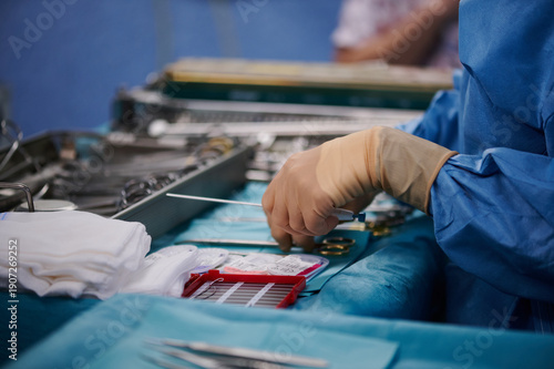 Nurse Handling Surgical Instruments on Operating Table in Hospital