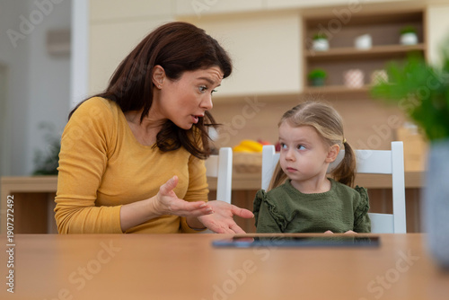 Canvas-taulu Mother having argument with reluctant daughter at home