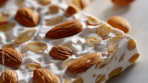 Stacked almond nougat bars showcasing a rich traditional confectionery texture.
