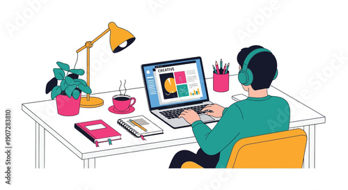 A person working on a laptop at a desk with office supplies