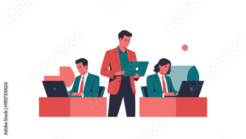 Businessman standing with coworkers working on laptops in office