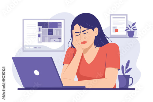 A stressed woman sitting at a desk with a laptop and looking tired at work.
