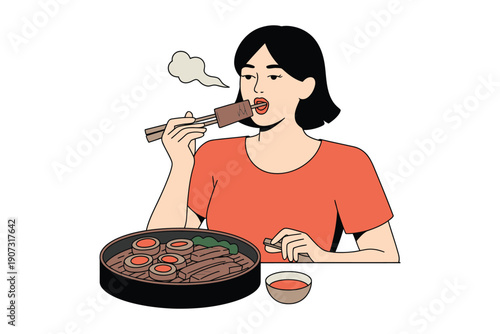 A woman eating Korean barbecue with chopsticks in a casual dining setting