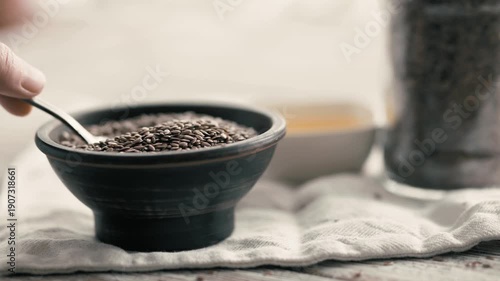 Organic linseed oil and seeds on rustic wooden surface, healthy nutrition.