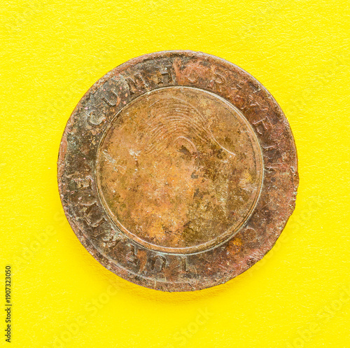 Wallpaper Mural Obverse side of vintage Turkish coin with scratches on bright yellow background showing worn metal texture and historical details Torontodigital.ca
