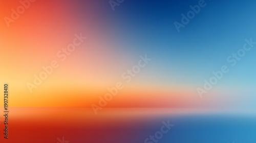 Vibrant sunset hues blending into a calm ocean backdrop.