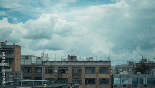Cloudy Sky Above City Buildings During Afternoon Time in Urban Area