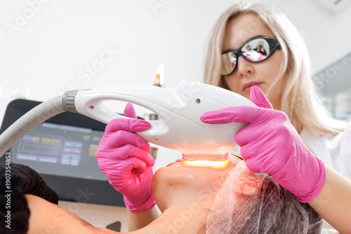 IPL intense pulsed light skin treatment performed by cosmetologist in clinic