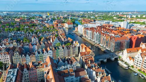 Aerial view of Gdansk Old Town with Motlawa River, colorful historic townhouses, medieval architecture and waterfront skyline