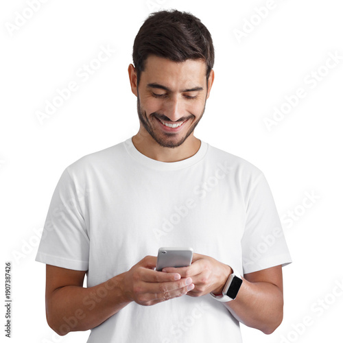 Happy young man smiling while looking down and typing on a smartphone